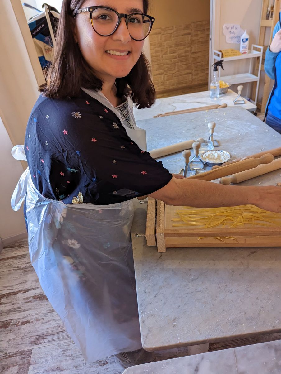 Woman making fresh pasta at a cooking class